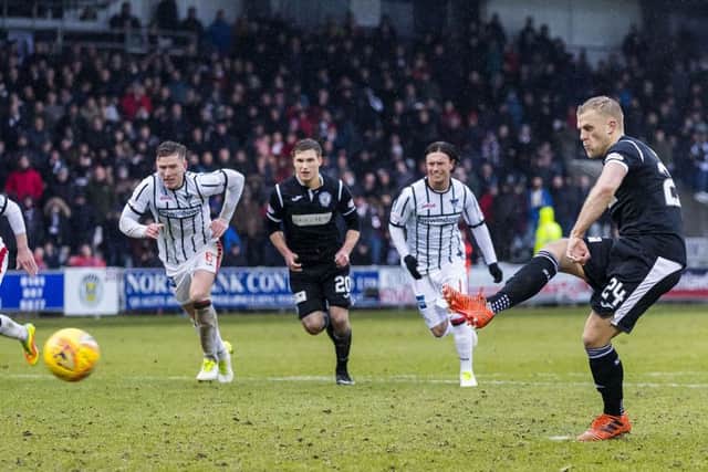 Harry Davis kept his calm and fired home a penalty for the home sides first goal.  Photograph: Roddy Scott/SNS Group