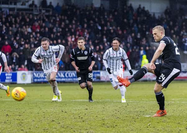 Harry Davis kept his calm and fired home a penalty for the home sides first goal.  Photograph: Roddy Scott/SNS Group