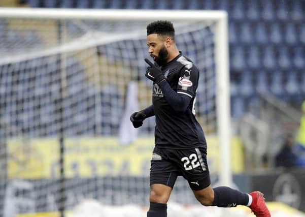 Alex Jakubiak celebrates netting Falkirk's third. Picture: Michael Gillen