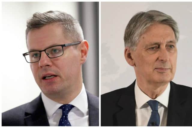 Derek Mackay, left, has called on Philip Hammond to provide more clarity on Brexit. Pictures: PA/Getty Images