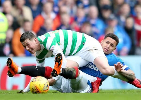 Callum McGregor and James Tavernier battle for the ball at Ibrox. Picture: PA