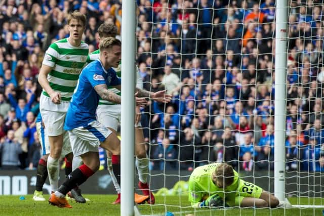 Scott Bain dives on the ball and Jason Cummings looks on in disbelief after Alfredo Morelos (behind Kristoffer Ajer) strikes the post. Picture: SNS.