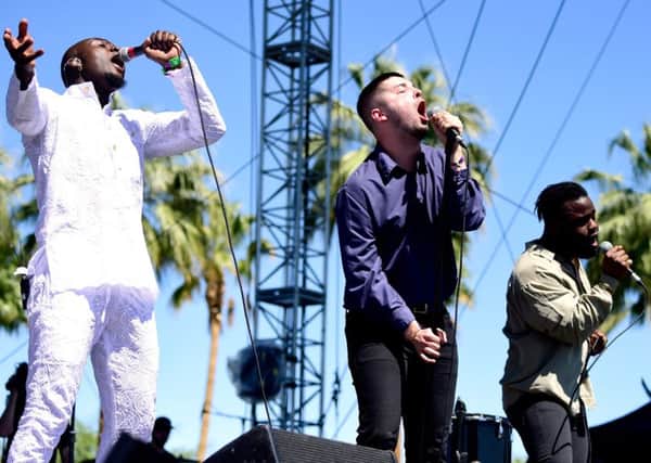 (L-R)  'G' Hastings, Kayus Bankole and Alloysious Massaquoi of Young Fathers perform onstage.  (Photo by Frazer Harrison/Getty Images for Coachella)