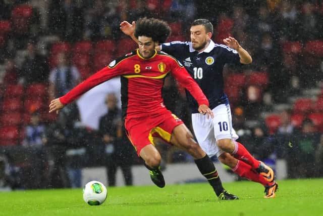 Marouane Fellaini battles for the ball with Robert Snodgrass during the last meeting between the two sides. Picture: Robert Perry