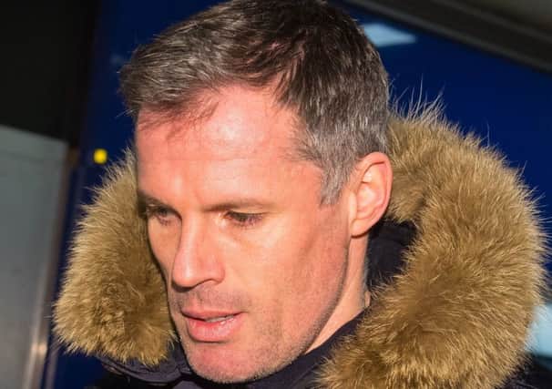 Jamie Carragher arrives at London Euston train station. Sky has suspended him as a football analyst. Picture: Dominic Lipinski/PA Wire