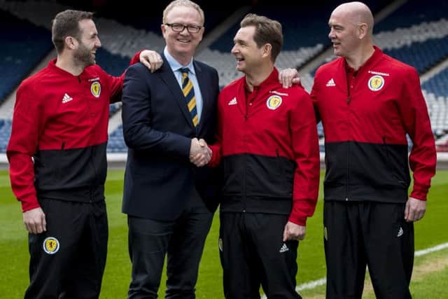 Scotland manager Alex McLeish with his backroom staff: James McFadden, left, Peter Grant and Stevie Woods, right, after his squad announcement at Hampden.Picture: Craig Williamson/SNS