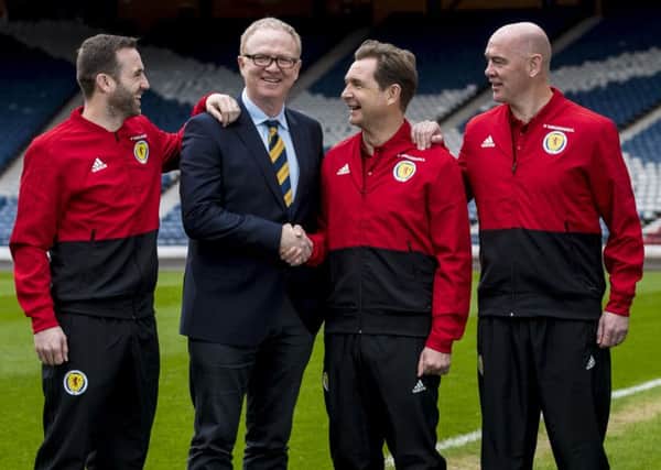 Scotland manager Alex McLeish with his backroom staff: James McFadden, left, Peter Grant and Stevie Woods, right, after his squad announcement at Hampden.Picture: Craig Williamson/SNS
