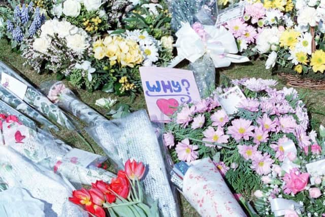 Flowers left for those who died in the massacre at Dunblane Primary School 22 years ago today. PIC: TSPL