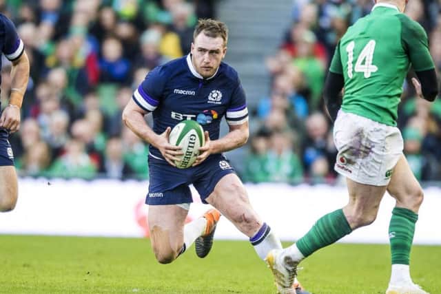 Scotland full-back Stuart Hogg launches a trademark attack with a sidestep past Ireland winger Keith Earls. Picture: Gary Hutchison/SNS/SRU