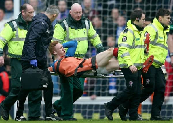 David Bates is stretchered off during the first half of Rangers' loss to Celtic. Picture: PA