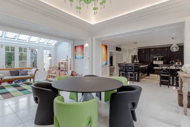 The contemporary kitchen extension and the conservatory. Pic: Savills