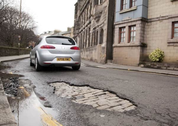 A large pothole in Coburg Street in Leith