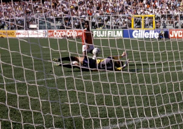 Juan Cayasso chips the ball over Jim Leighton to give Costa Rica a 1-0 victory over the Scots in Genoa. Photograph: SNS