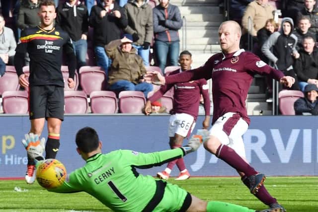 Steven Naismith beats Partick Thistle goalkeeper Tomas Cerny to score Hearts' second goal. Picture: SNS.