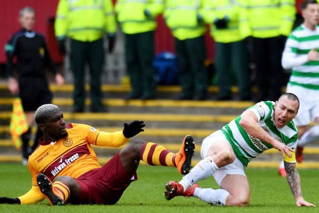 Motherwell's Cedric Kipre lashes out at Celtic captain Scott Brown. Picture: SNS