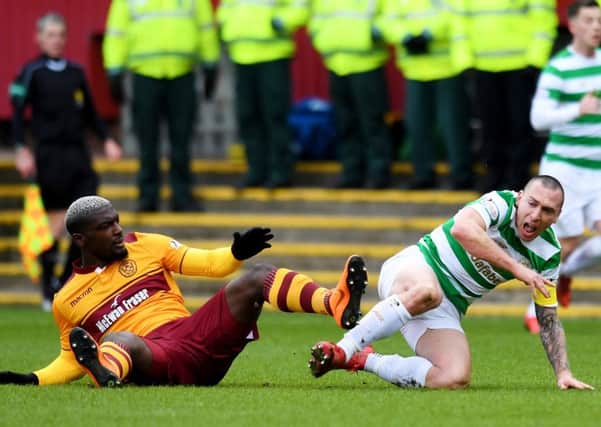 Motherwell's Cedric Kipre lashes out at Celtic captain Scott Brown. Picture: SNS