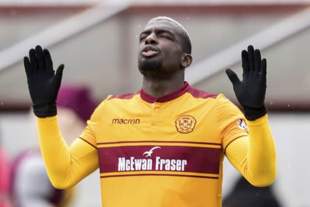 Cedric Kipre was shown a straight red card by referee Craig Thomson. Picture: SNS