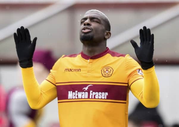 Cedric Kipre was shown a straight red card by referee Craig Thomson. Picture: SNS