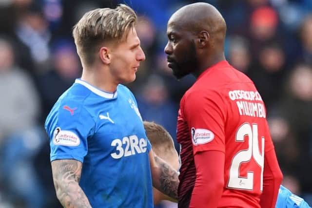 Jason Cummings and Youssouf Mulumbu square up during Rangers' defeat to Kilmarnock on Saturday. Picture: SNS