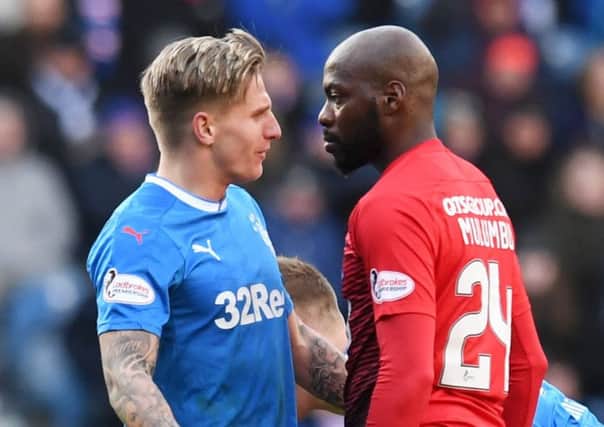Jason Cummings and Youssouf Mulumbu square up during Rangers' defeat to Kilmarnock on Saturday. Picture: SNS