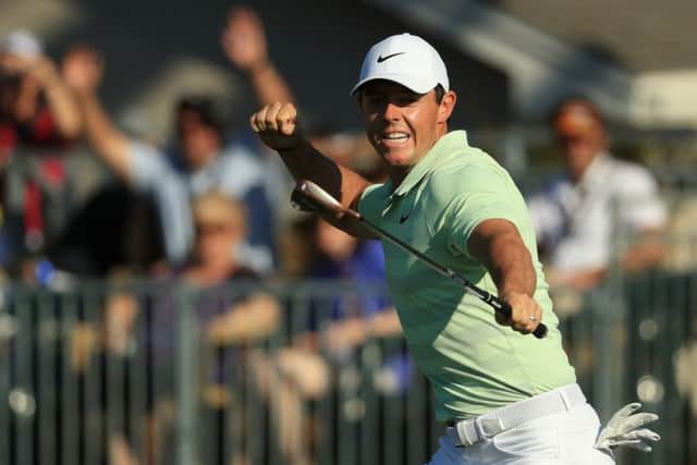 Rory McIlroy celebrates after holing his birdie putt at the 15th in the final round. Picture: Getty Images