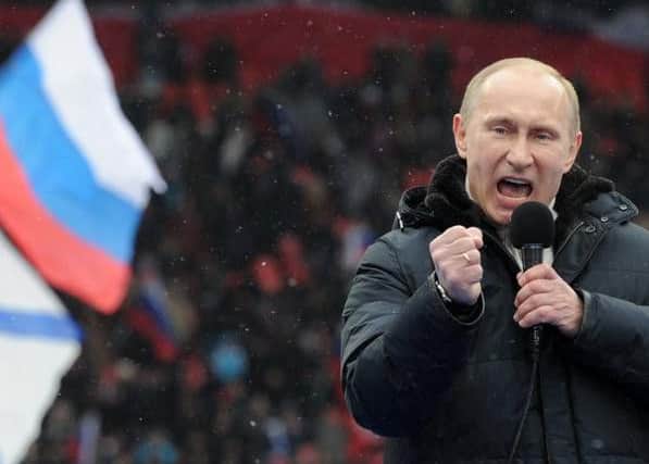 Putin addresses a rally during his election campaign. Picture: Getty
