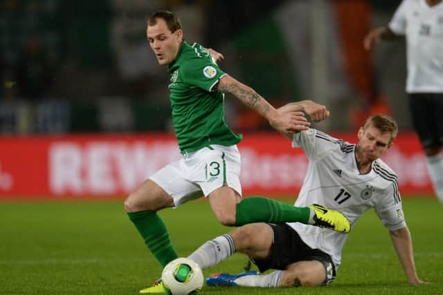 Anthony Stokes holds off Per Mertesacker during a 2014 World Cup qualifier between the Republic of Ireland and Germany in October 2013. Picture: AFP/Getty Images