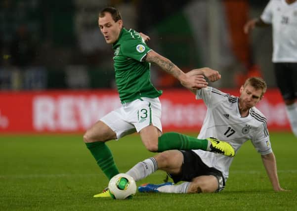 Anthony Stokes holds off Per Mertesacker during a 2014 World Cup qualifier between the Republic of Ireland and Germany in October 2013. Picture: AFP/Getty Images