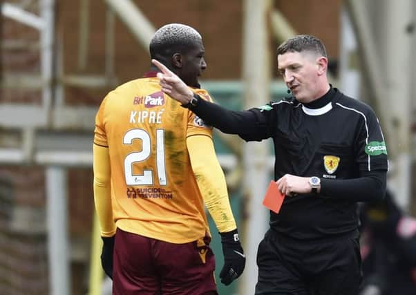Craig Thomson gives Cedric Kipre his marching orders. Picture: SNS Group