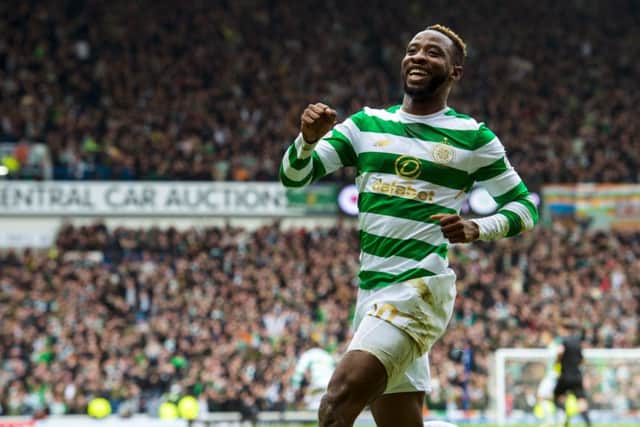 Moussa Dembele celebrates after scoring at Ibrox. Picture: SNS