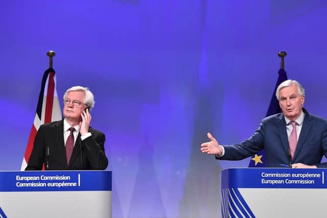 Brexit minister David Davis (left) and EU chief negotiator Michel Barnier address a press conference following a landmark deal on transition arrangements. Picture: AFP