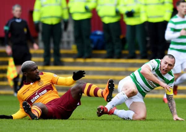 Cedric Kipre received a straight red card for kicking out at Scott Brown. Picture: SNS