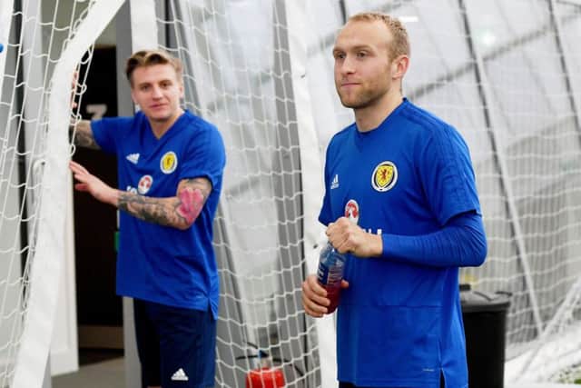 Dylan McGeouch, right, with former Hibs team-mate Jason Cummings. Picture: SNS