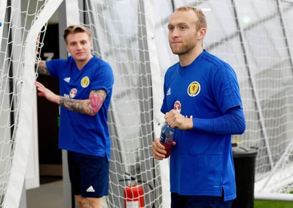 Dylan McGeouch, right, with former Hibs team-mate Jason Cummings. Picture: SNS