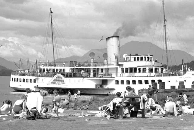 Holidaymakers enjoy the sun in Balloch as the Maid of the Forth paddle steamer passes by in Loch Lomond, July 1972. PIC: Contributed.
