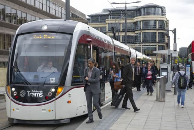 Passengers disembark an east-bound tram at Haymarket. Picture: Ian Rutherford