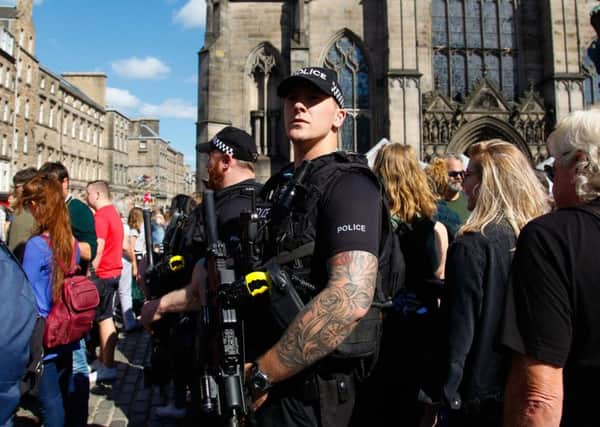 Armed police on Edinburgh's High Street during the Fringe Festival. Pic: Scott Louden