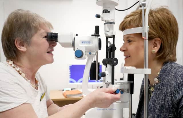 Scotland's First Minister Nicola Sturgeon has her eyes tested by ophthalmologist Dr Ida Boron. Picture: Jane Barlow