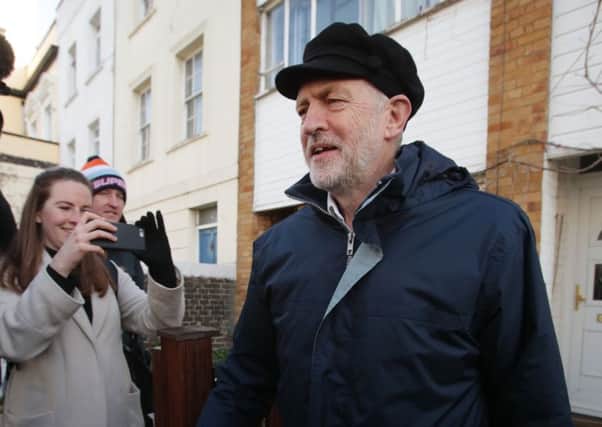 Jeremy Corbyn in a not-particularly-Russian-looking cap (Picture: PA)