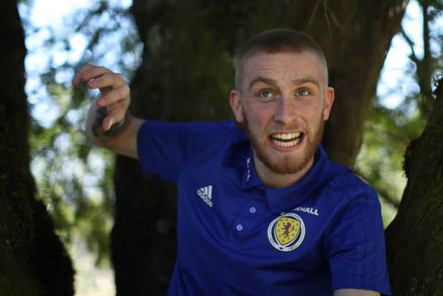 Scotland striker Oli McBurnie larks about at Oriam. Picture: Getty images