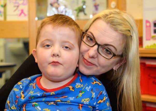 Murray Gray, seen with his mum Karen, suffers from regular epileptic seizures and cannabidiol oil is the only thing that makes a difference (Picture: Ian Georgeson)