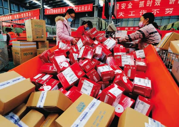 Workers prepare boxes for packaging goods for delivery at a sorting center in Lianyungang, Jiangsu province during the Singles Day online shopping festival. Photo: Getty Images