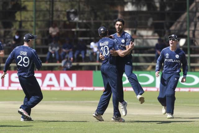 Scotland celebrate the wicket of West Indies batsman Chris Gayle at Harare Sports Club. Picture: AP Photo/Tsvangirayi Mukwazhi
