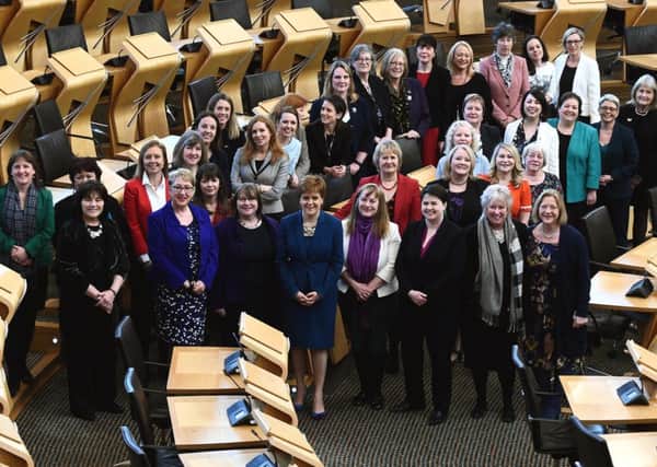 Female MSPs gather at Holyrood to celebrate the centenary of women over 30 getting the vote (Picture: Lisa Ferguson)