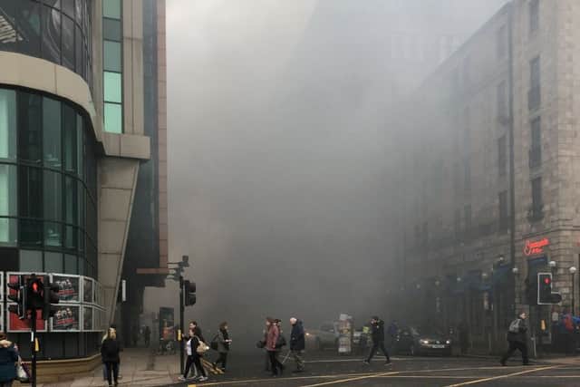 Smoke from the a fire on Sauchiehall Street fills the surrounding streets. Pic: SWNS