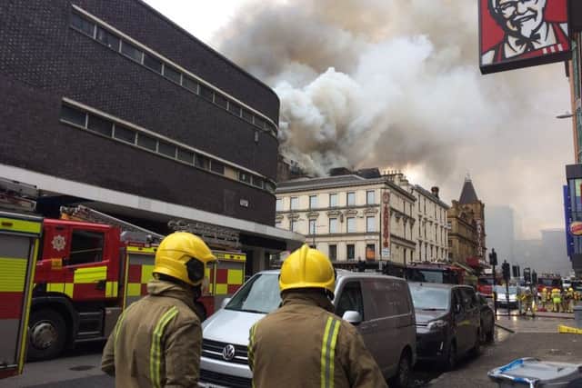 Fire on Renfield Street Glasgow which is believed to have started in Victoria's  nightclub. Smoke rised over the Pavillion Theatre.