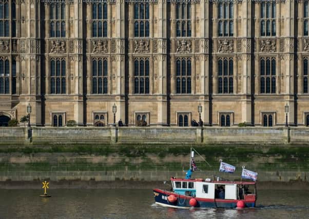 Former UKIP party leader Nigel Farage and Fishing for Leave supporters pass the Houses of Parliament before throwing fish overboard into the River Thames (Photo by Chris J Ratcliffe/Getty Images)