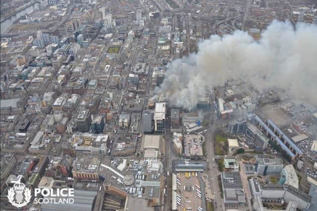 Smoke billows into the air from the scene of the Sauchiehall Street fire