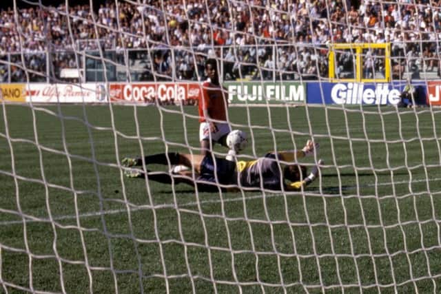 Costa Rica's Juan Cayasso chips the ball over Jim Leighton to score the only goal of the game as Scotland lose their opening match at the 1990 World Cup in Italy. Picture: SNS