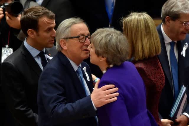 European Commission President Jean-Claude Juncker (2nd L) welcomes British Prime Minister Theresa May (R). Pic: AFP/Getty